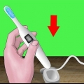 Usando uma escova de dentes elétrica
