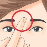 Usando acupressão para enxaquecas e dores de cabeça