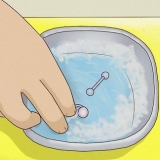 Cuidando de um piercing no umbigo durante a gravidez