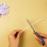 Fazendo um pom pom de fios