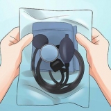 Determine sua pressão arterial com um monitor de pressão arterial