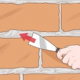 Remoção de argamassa de tijolos