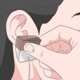 Reduzir a dor causada por um novo piercing
