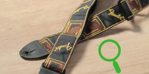 Como anexar uma alça de guitarra à sua guitarra