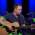 Dedilhar uma guitarra