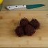Comer um rambutan